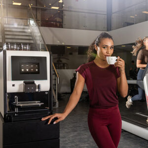 Primo compact X with lady drinking coffee