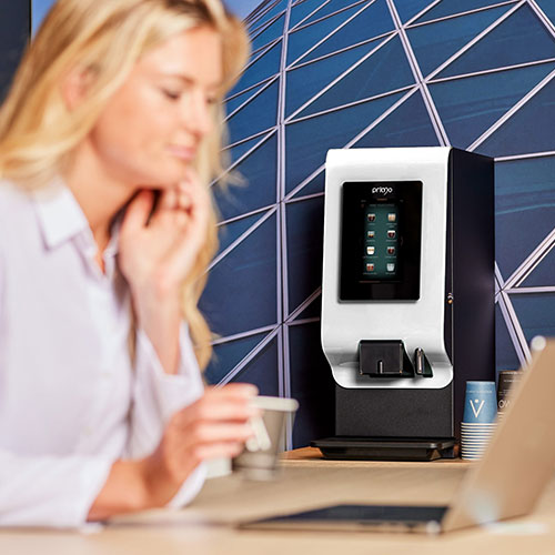 primo mini with lady drinking coffee